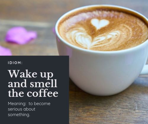 A cup of coffee with a heart-shaped design in the milk with the idiom 